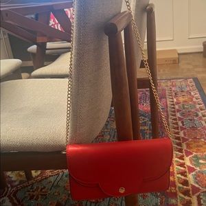 Reddish/Orange small purse with gold link strap